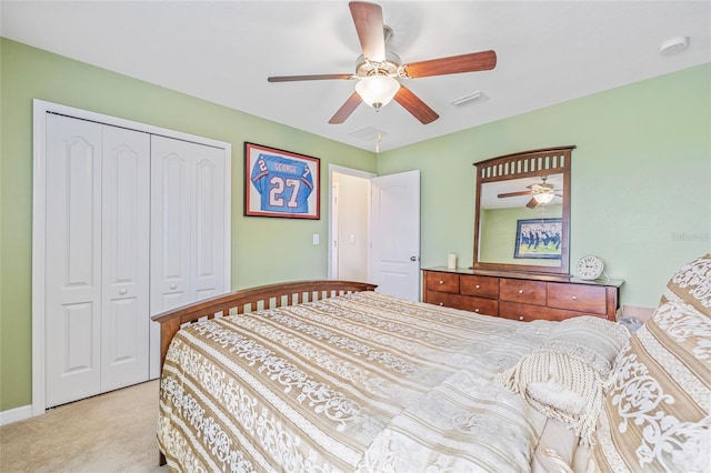 12244 Fairlawn Dr, Riverview, FL 33579 - bedroom featuring light carpet, a closet, and a ceiling fan