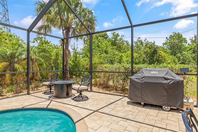 12244 Fairlawn Dr, Riverview, FL 33579 - swimming pool with area for grilling, a patio, a lanai, and a fire pit