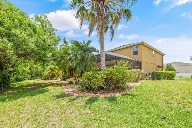 12244 Fairlawn Dr, Riverview, FL 33579 - view of green lawn with glass enclosure