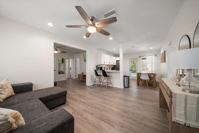 608 Bay Esplanade, Clearwater Beach, FL 33767 - living room with a ceiling fan, light wood-type flooring, and recessed lighting