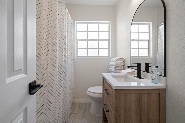 608 Bay Esplanade, Clearwater Beach, FL 33767 - bathroom featuring vanity, a closet, and wood finished floors