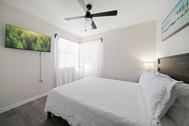608 Bay Esplanade, Clearwater Beach, FL 33767 - bedroom with wood finished floors and a ceiling fan