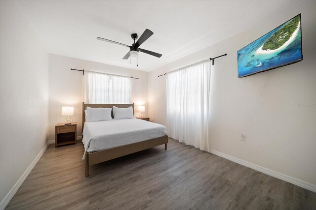608 Bay Esplanade, Clearwater Beach, FL 33767 - bedroom with wood finished floors and a ceiling fan