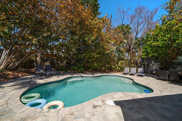 608 Bay Esplanade, Clearwater Beach, FL 33767 - view of swimming pool featuring a patio and a fenced backyard