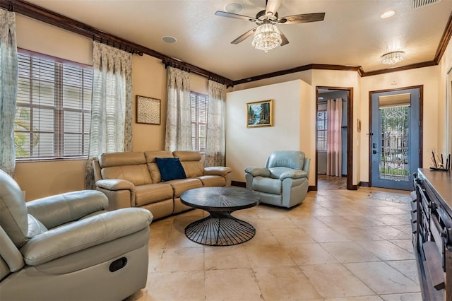 4400 English Turn Way, Wesley Chapel, FL 33543 - living room with a ceiling fan, baseboards, ornamental molding, and light tile patterned floors