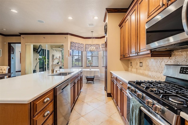 4400 English Turn Way, Wesley Chapel, FL 33543 - kitchen with stainless steel appliances, a sink, brown cabinetry, light countertops, and tasteful backsplash