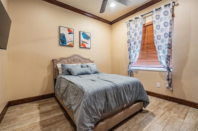 4400 English Turn Way, Wesley Chapel, FL 33543 - bedroom with ornamental molding, light wood-type flooring, baseboards, and a ceiling fan