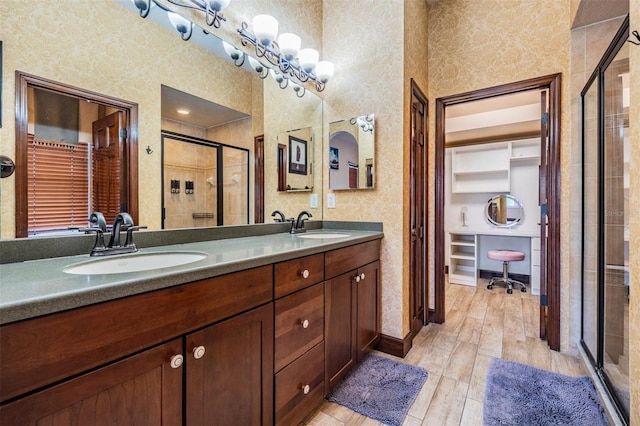4400 English Turn Way, Wesley Chapel, FL 33543 - bathroom featuring a stall shower, wood finished floors, double vanity, and baseboards