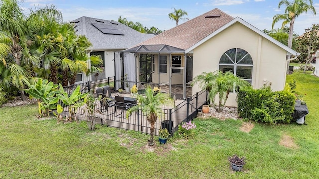 4400 English Turn Way, Wesley Chapel, FL 33543 - rear view of house featuring a patio area, stucco siding, roof with shingles, and glass enclosure