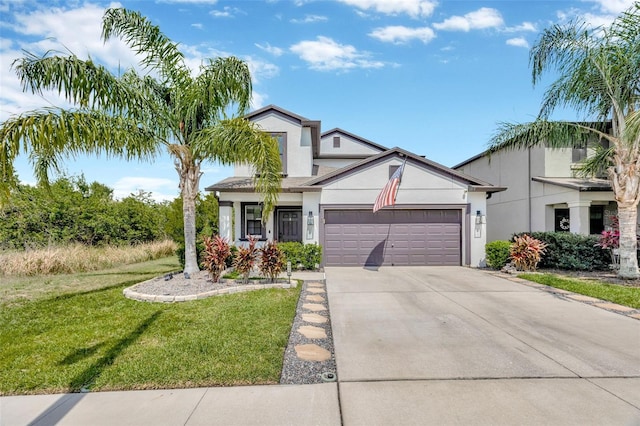 14716 Crescent Rock Dr, Wimauma, FL 33598 - view of front of property with stucco siding, an attached garage, driveway, and a front lawn