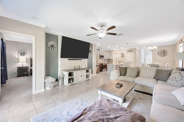 14716 Crescent Rock Dr, Wimauma, FL 33598 - living room featuring crown molding, a chandelier, a ceiling fan, light tile patterned flooring, and baseboards