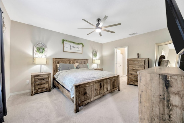 14716 Crescent Rock Dr, Wimauma, FL 33598 - bedroom with light colored carpet, ceiling fan, and baseboards