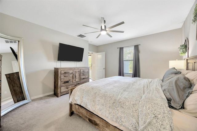 14716 Crescent Rock Dr, Wimauma, FL 33598 - bedroom with light carpet, a ceiling fan, and baseboards
