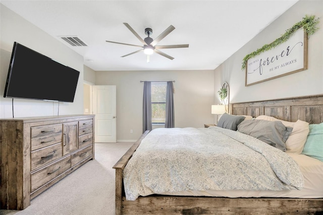 14716 Crescent Rock Dr, Wimauma, FL 33598 - bedroom with light carpet, a ceiling fan, and baseboards
