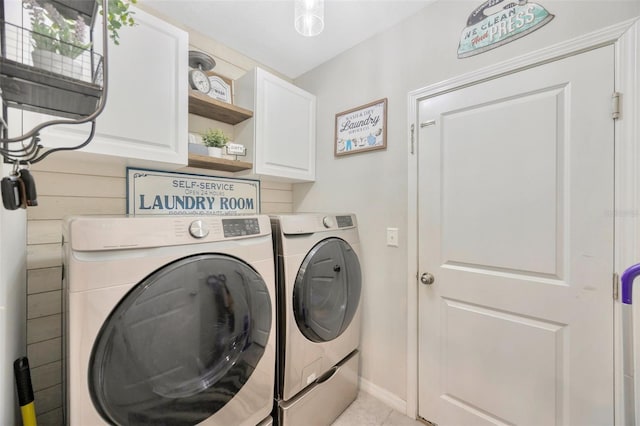 14716 Crescent Rock Dr, Wimauma, FL 33598 - washroom featuring cabinet space, independent washer and dryer, baseboards, and light tile patterned floors