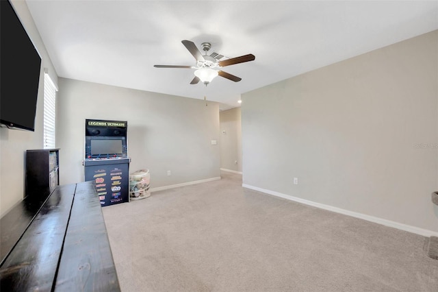 14716 Crescent Rock Dr, Wimauma, FL 33598 - unfurnished living room featuring a ceiling fan, carpet, and baseboards