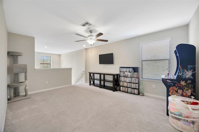 14716 Crescent Rock Dr, Wimauma, FL 33598 - living area featuring an upstairs landing, baseboards, carpet, ceiling fan, and recessed lighting