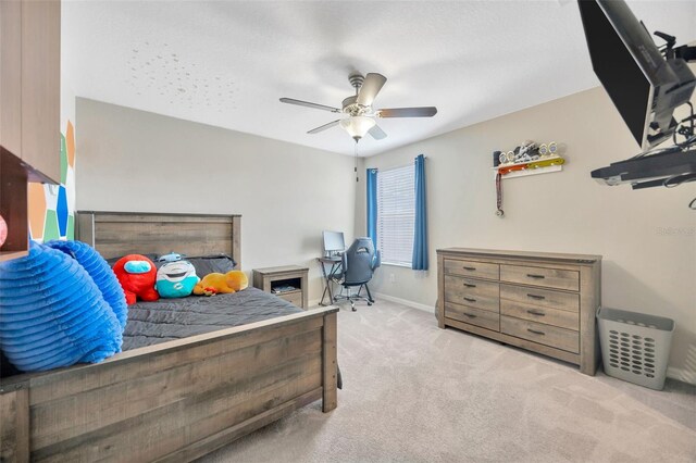 14716 Crescent Rock Dr, Wimauma, FL 33598 - carpeted bedroom with a ceiling fan and baseboards