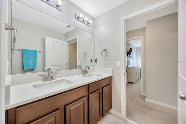 14716 Crescent Rock Dr, Wimauma, FL 33598 - full bathroom with double vanity and baseboards