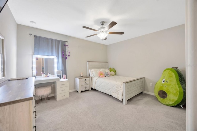 14716 Crescent Rock Dr, Wimauma, FL 33598 - bedroom with light colored carpet, ceiling fan, and baseboards