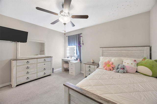 14716 Crescent Rock Dr, Wimauma, FL 33598 - bedroom with light colored carpet, baseboards, and ceiling fan