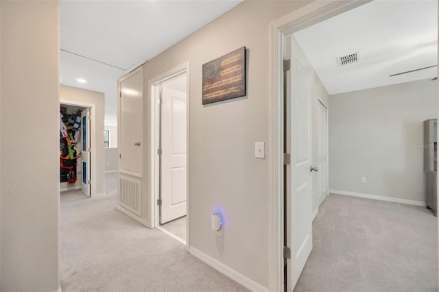 14716 Crescent Rock Dr, Wimauma, FL 33598 - corridor with light carpet, baseboards, and recessed lighting