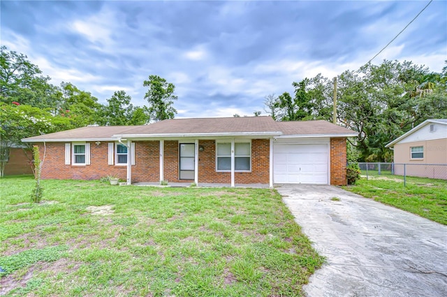 40019 Pretty Redbird Rd, Zephyrhills, FL 33540 - ranch-style home featuring a garage, brick siding, and driveway