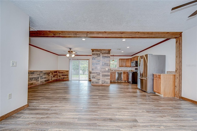 40019 Pretty Redbird Rd, Zephyrhills, FL 33540 - unfurnished living room with a ceiling fan, light wood-type flooring, a textured ceiling, recessed lighting, and baseboards