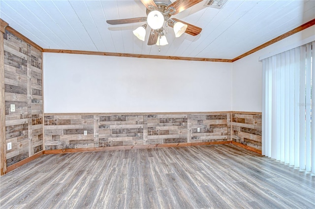 40019 Pretty Redbird Rd, Zephyrhills, FL 33540 - empty room with wood walls, wood finished floors, wood ceiling, crown molding, and a wainscoted wall