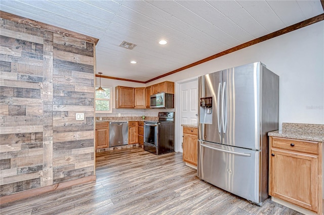 40019 Pretty Redbird Rd, Zephyrhills, FL 33540 - kitchen with appliances with stainless steel finishes, crown molding, light wood-type flooring, light stone counters, and recessed lighting