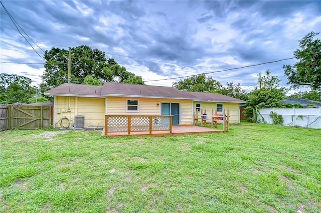 40019 Pretty Redbird Rd, Zephyrhills, FL 33540 - back of house featuring a wooden deck, cooling unit, and a gate