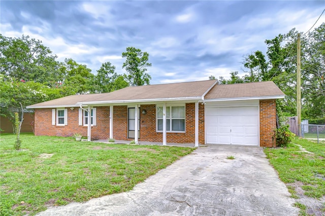 40019 Pretty Redbird Rd, Zephyrhills, FL 33540 - single story home featuring an attached garage, brick siding, and driveway