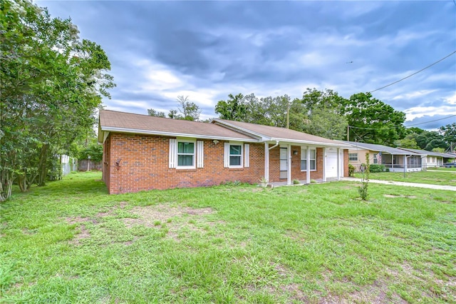 40019 Pretty Redbird Rd, Zephyrhills, FL 33540 - single story home featuring brick siding, a garage, driveway, and a shingled roof