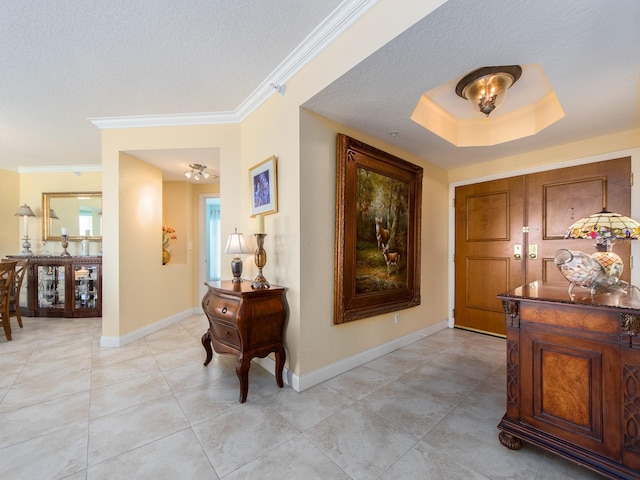 1170 Gulf Blvd Unit 1006, Clearwater Beach, FL 33767 - foyer with baseboards, ornamental molding, light tile patterned floors, and a textured ceiling