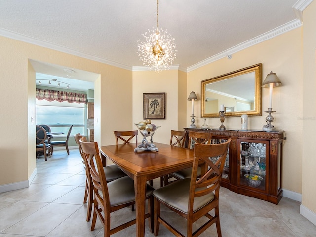 1170 Gulf Blvd Unit 1006, Clearwater Beach, FL 33767 - dining area with crown molding, a chandelier, light tile patterned floors, baseboards, and a textured ceiling