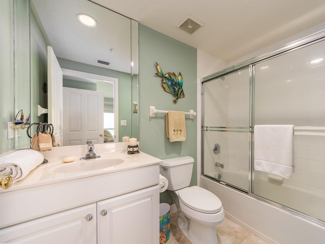 1170 Gulf Blvd Unit 1006, Clearwater Beach, FL 33767 - bathroom featuring vanity, combined bath / shower with glass door, toilet, tile patterned flooring, and recessed lighting