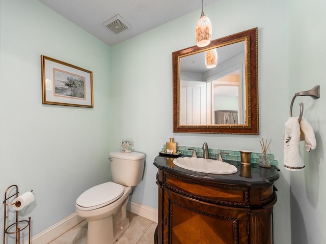 1170 Gulf Blvd Unit 1006, Clearwater Beach, FL 33767 - bathroom with vanity, toilet, baseboards, and tile patterned flooring