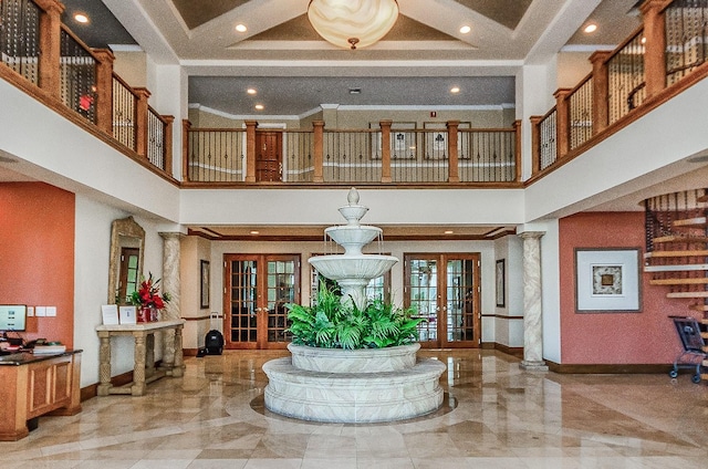 1170 Gulf Blvd Unit 1006, Clearwater Beach, FL 33767 - entrance foyer with french doors, marble tiled flooring, a high ceiling, baseboards, and crown molding