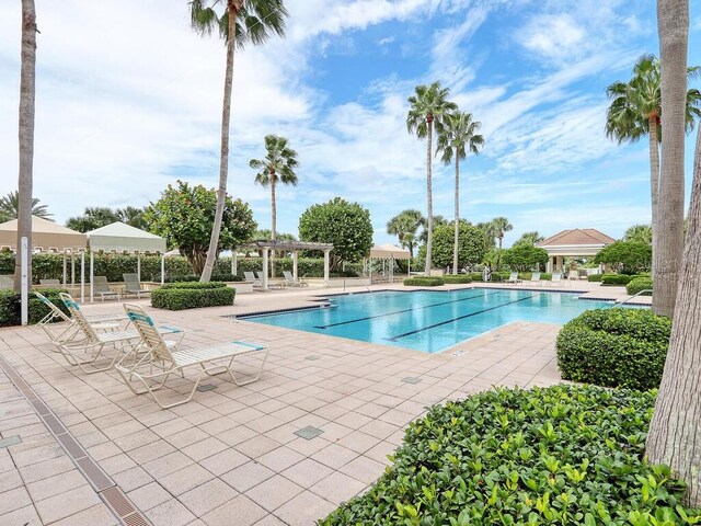 1170 Gulf Blvd Unit 1006, Clearwater Beach, FL 33767 - community pool with a pergola and a patio area