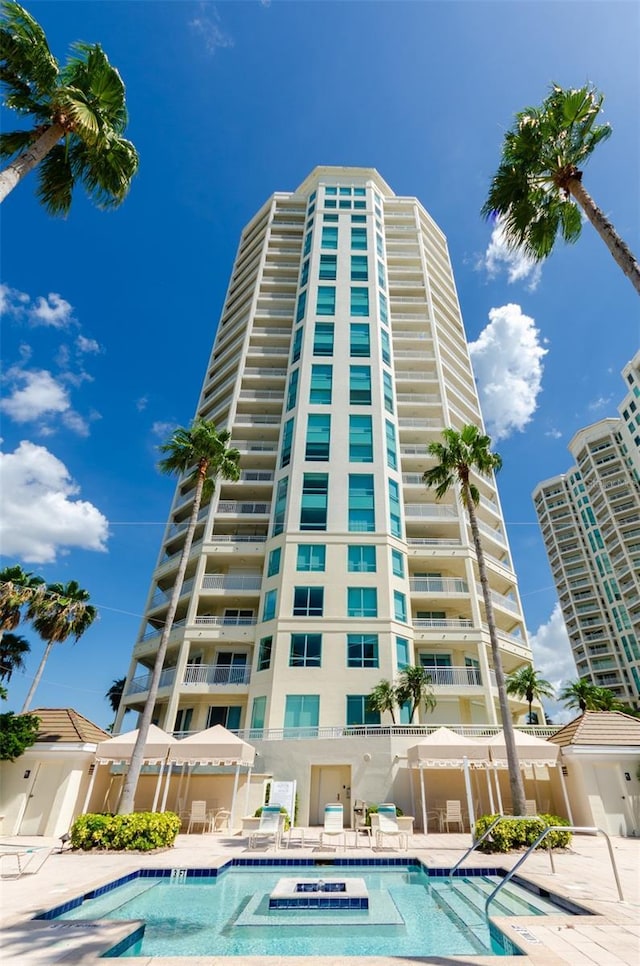 1170 Gulf Blvd Unit 1006, Clearwater Beach, FL 33767 - community pool featuring a patio area