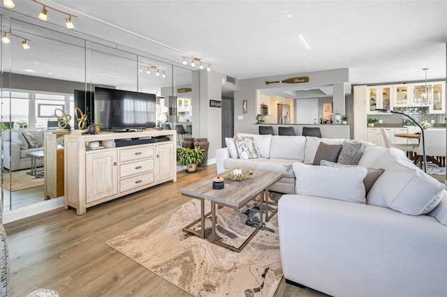 1621 Gulf Blvd Unit 407, Clearwater Beach, FL 33767 - living room featuring light wood-type flooring