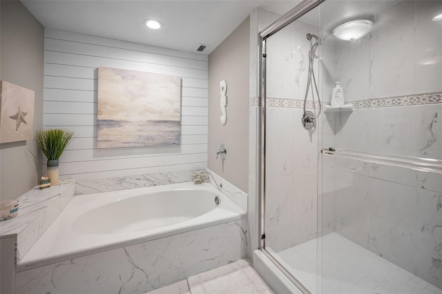 1621 Gulf Blvd Unit 407, Clearwater Beach, FL 33767 - bathroom featuring a bath, a marble finish shower, and recessed lighting