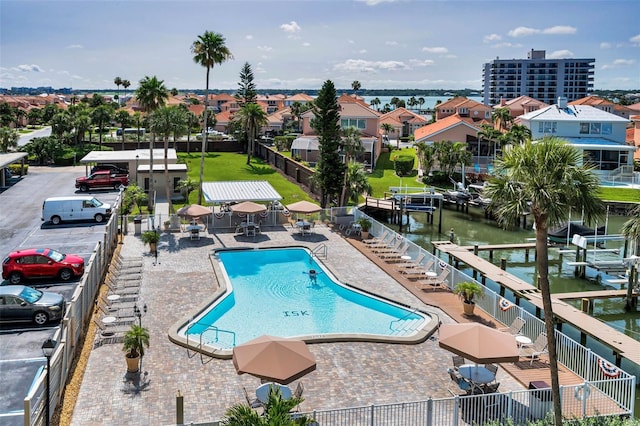 1621 Gulf Blvd Unit 407, Clearwater Beach, FL 33767 - community pool featuring a water view and a patio