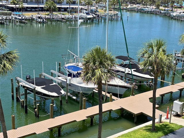 1621 Gulf Blvd Unit 407, Clearwater Beach, FL 33767 - dock area with boat lift, a water view, and view of marina