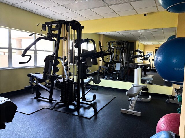 1621 Gulf Blvd Unit 407, Clearwater Beach, FL 33767 - exercise room featuring a drop ceiling and baseboards