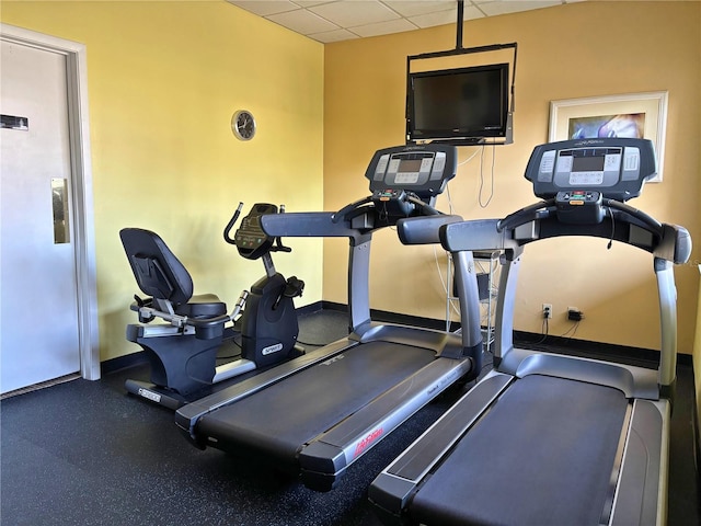 1621 Gulf Blvd Unit 407, Clearwater Beach, FL 33767 - workout area with a paneled ceiling and baseboards