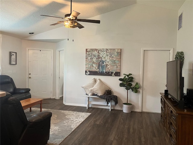 6905 Summer Harbor Ln, Riverview, FL 33578 - living room featuring vaulted ceiling, a ceiling fan, dark wood-style flooring, baseboards, and a textured ceiling