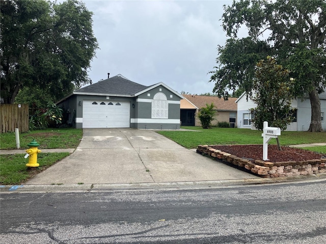 6905 Summer Harbor Ln, Riverview, FL 33578 - ranch-style home featuring an attached garage, stucco siding, driveway, and a shingled roof