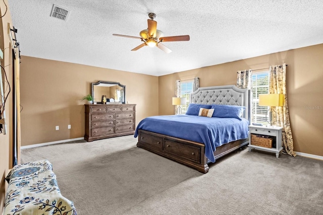 2541 W Castle Rd, Citrus Springs, FL 34434 - bedroom with a textured ceiling, carpet, ceiling fan, and baseboards
