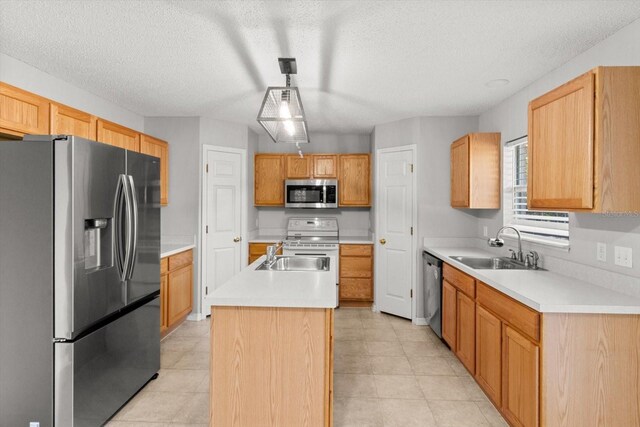 2541 W Castle Rd, Citrus Springs, FL 34434 - kitchen with stainless steel appliances, a sink, an island with sink, light countertops, and a textured ceiling